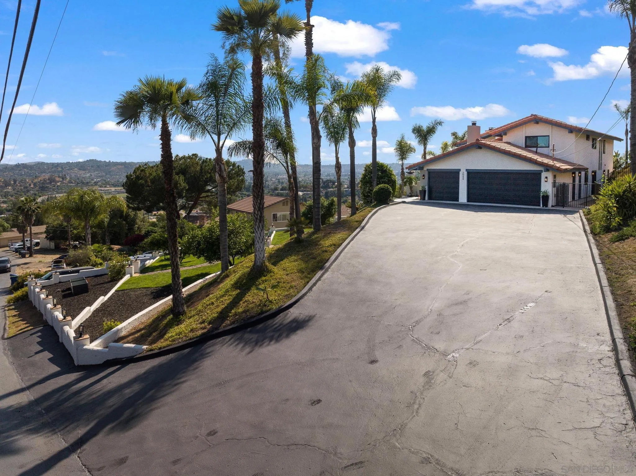 2044 Eula Lane El Cajon, CA 92019 - Photo 42 of 47 a view of a house with a yard and potted plants