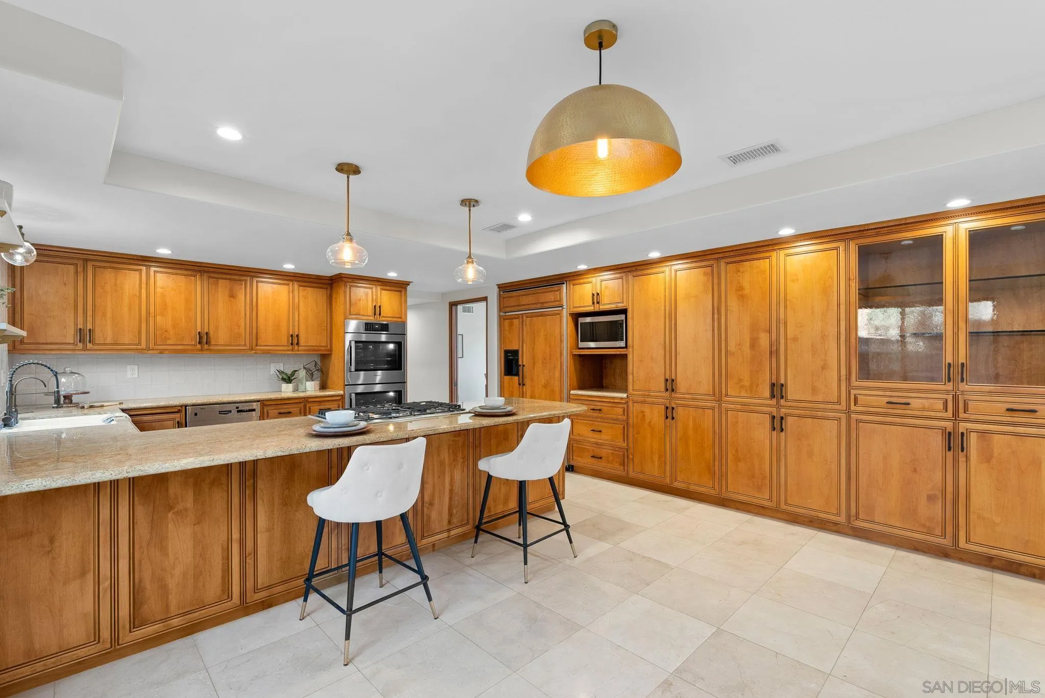 2044 Eula Lane El Cajon, CA 92019 - Photo 7 of 47 a kitchen with stainless steel appliances granite countertop a sink a stove and a refrigerator