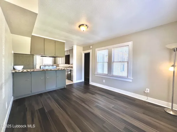 a view of kitchen with window and wooden floor