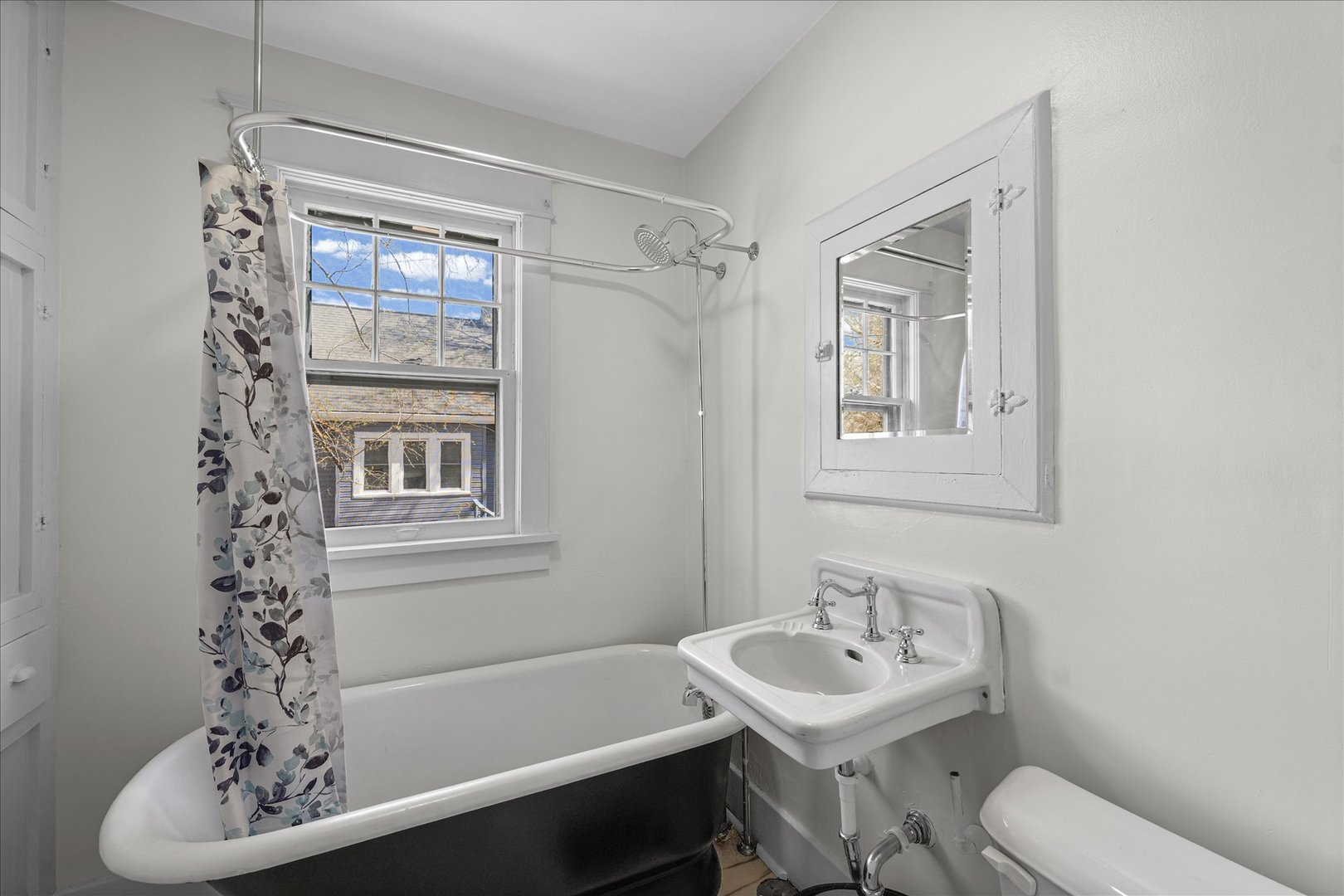 1011 West Vine Street Champaign, IL 61821 - Photo 15 of 19 a bathroom with a sink toilet and shower