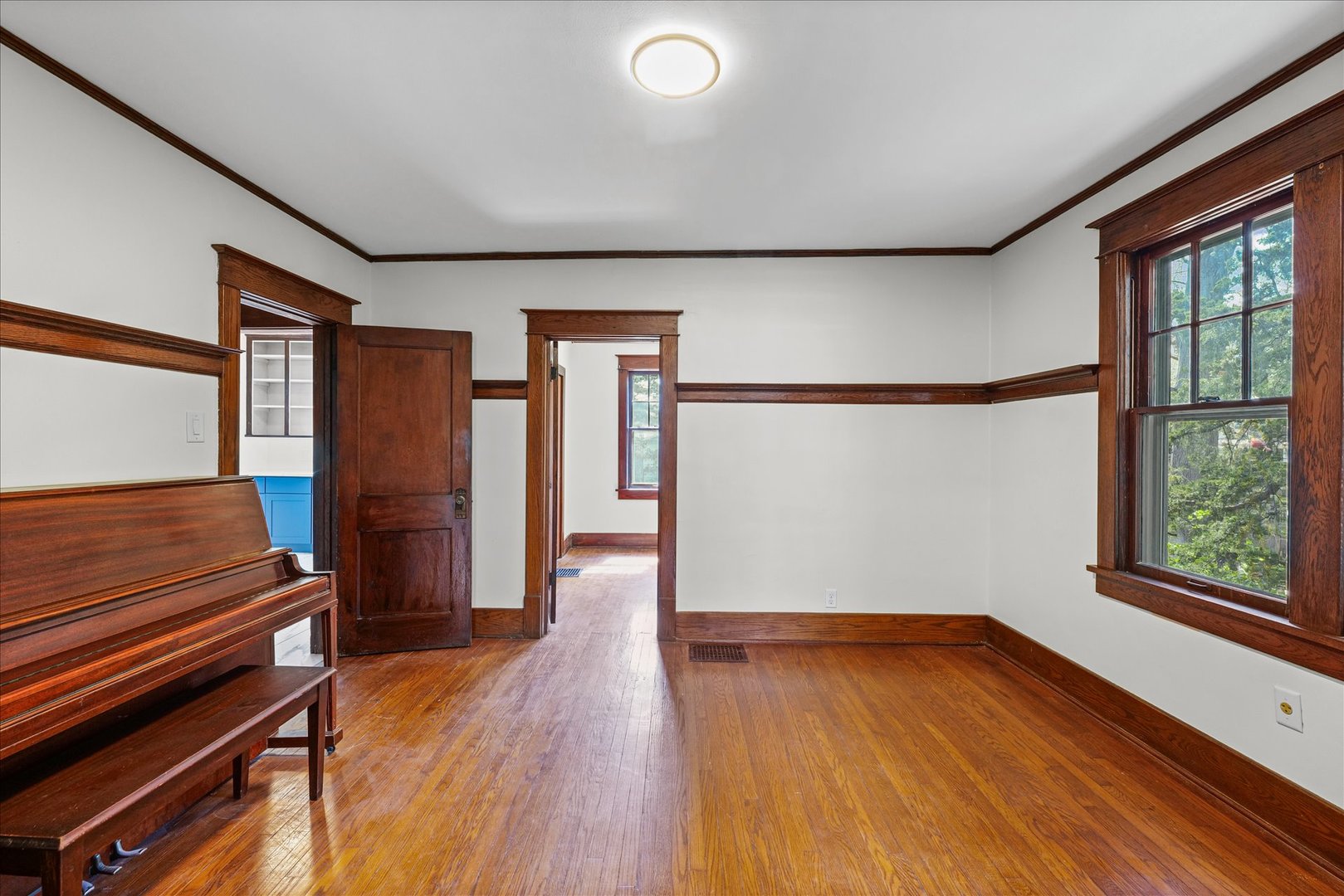 1011 West Vine Street Champaign, IL 61821 - Photo 9 of 19 wooden floor in an empty room with a window