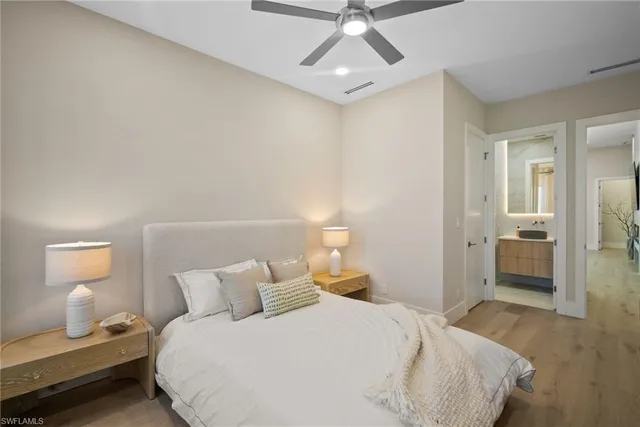 a bedroom with a bed and a lamp