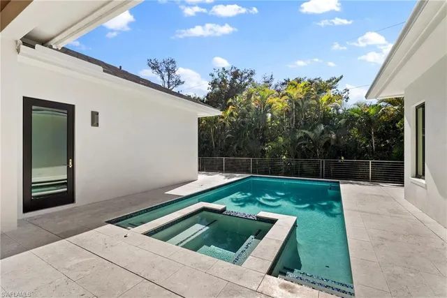 a view of backyard with trampoline