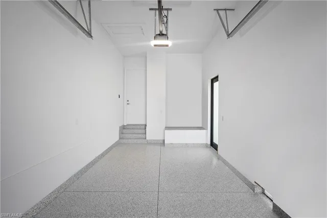a view of a livingroom with a ceiling fan and window