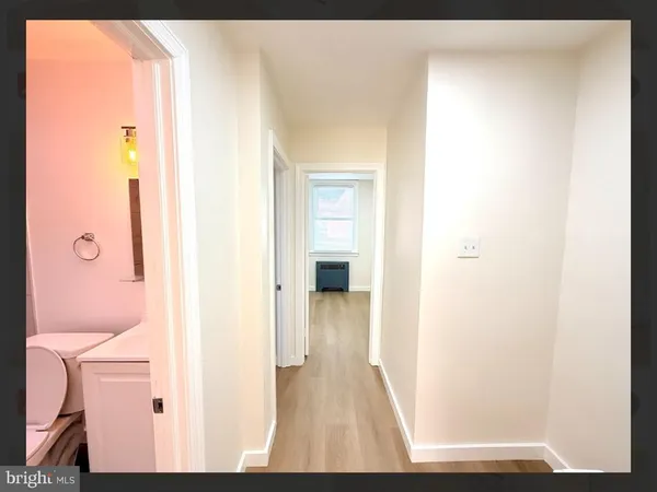 a view of a bedroom from a hallway