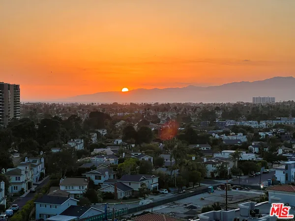 a view of a city with mountain