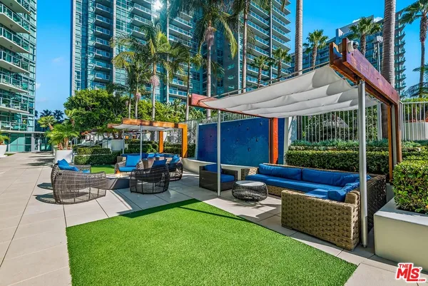 a view of a swimming pool with a lounge chairs