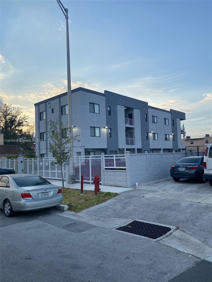 423 East 27th Street, Unit 101 Hialeah, FL 33013 - Photo 9 of 9 a view of car parked in front of house