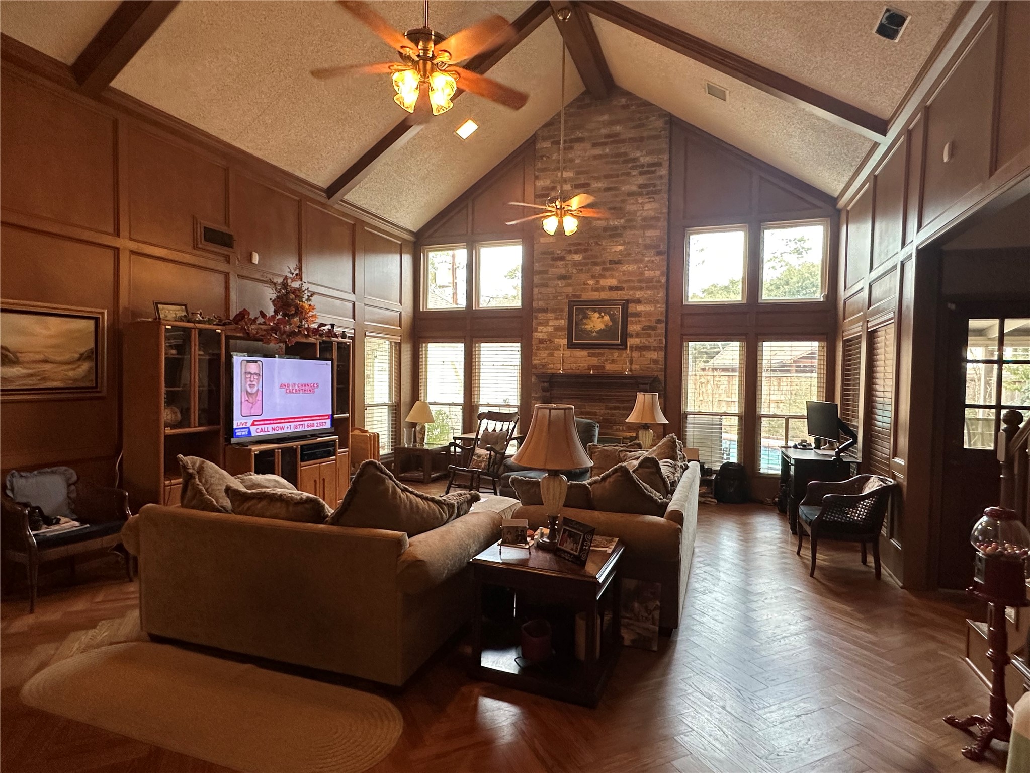 16114 Hexham Drive Spring, TX 77379 - Photo 5 of 18 A view of the grand living room will ceiling to floor windows, vaulted ceilings and wood floors.