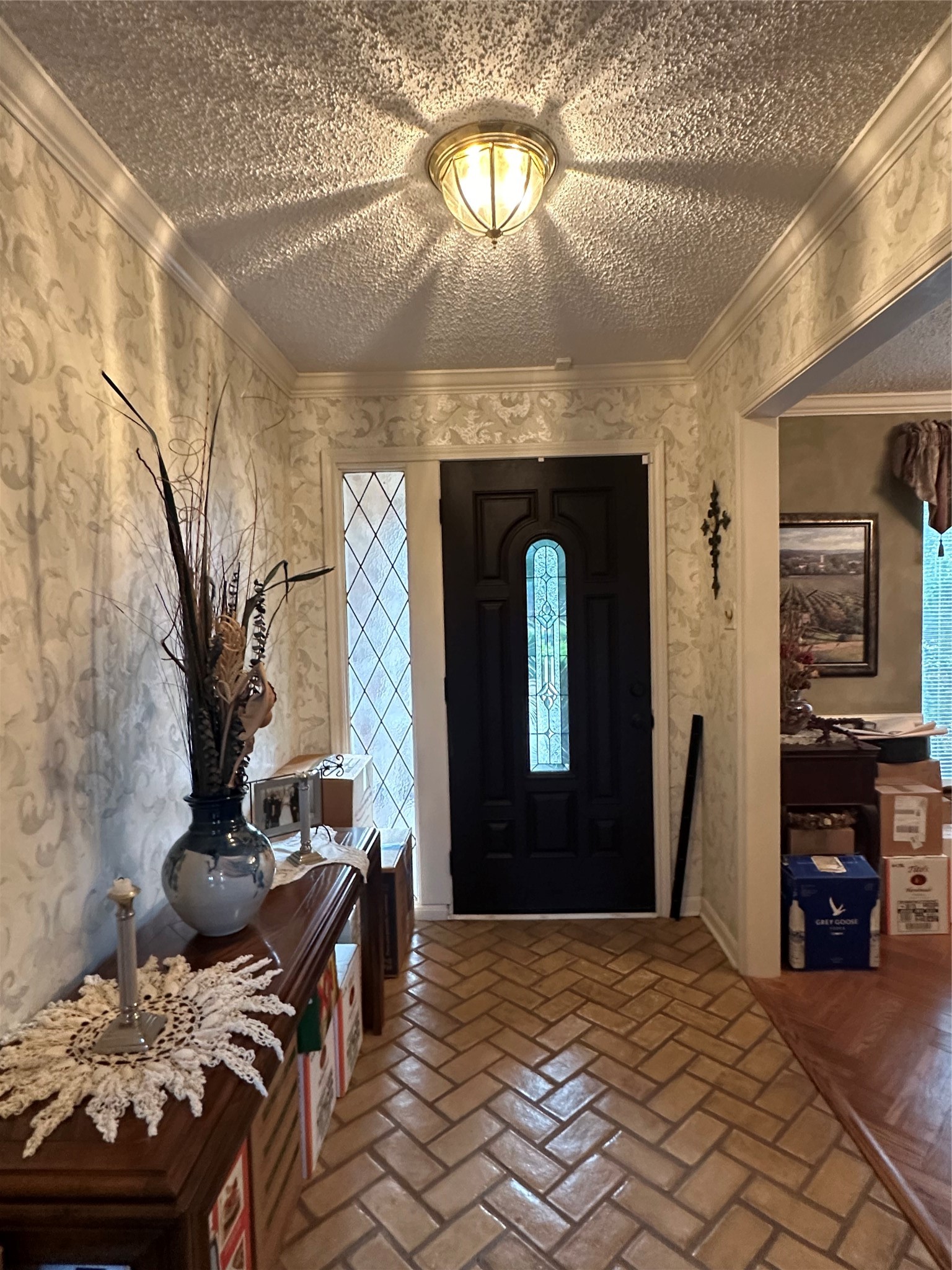 16114 Hexham Drive Spring, TX 77379 - Photo 7 of 18 View of the entry with door light, side light and herringbone tile with access to the formal dining room and living room.