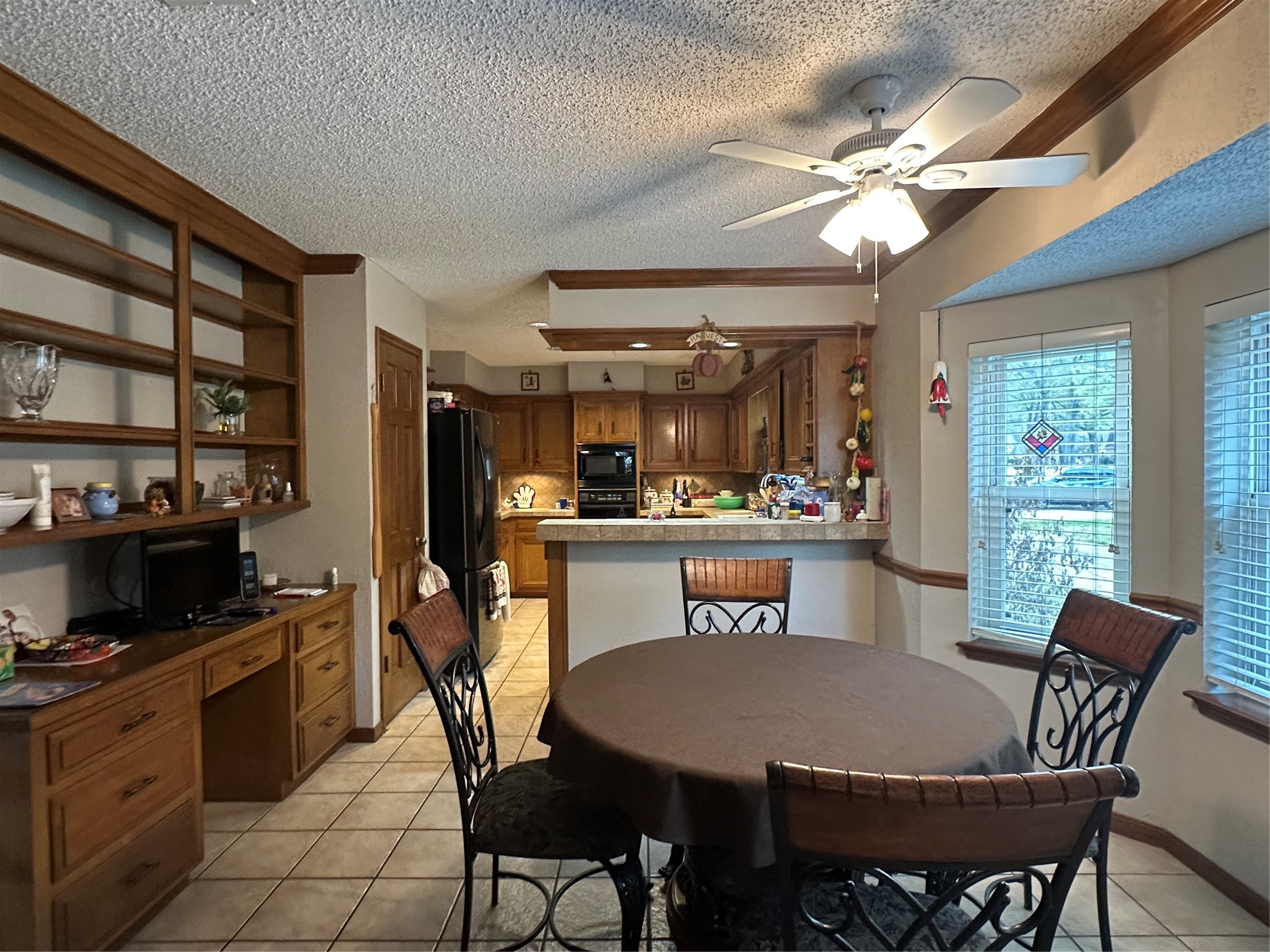 16114 Hexham Drive Spring, TX 77379 - Photo 10 of 18 View of the breakfast room and built in cabinet desk combo.