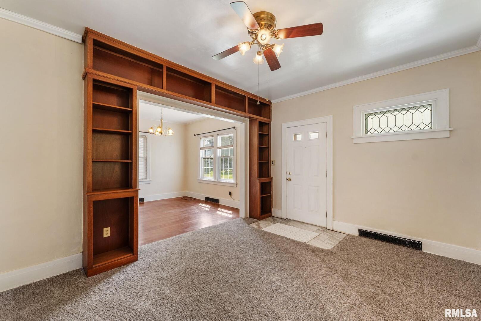 1904 30th Street Moline, IL 61265 - Photo 4 of 13 wooden floor in an empty room with a window