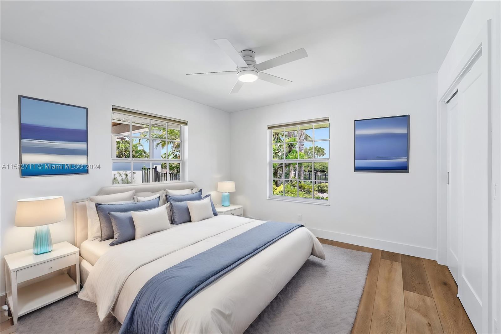 8547 Southeast Merritt Way Jupiter, FL 33458 - Photo 15 of 27 a bedroom with a bed and a window