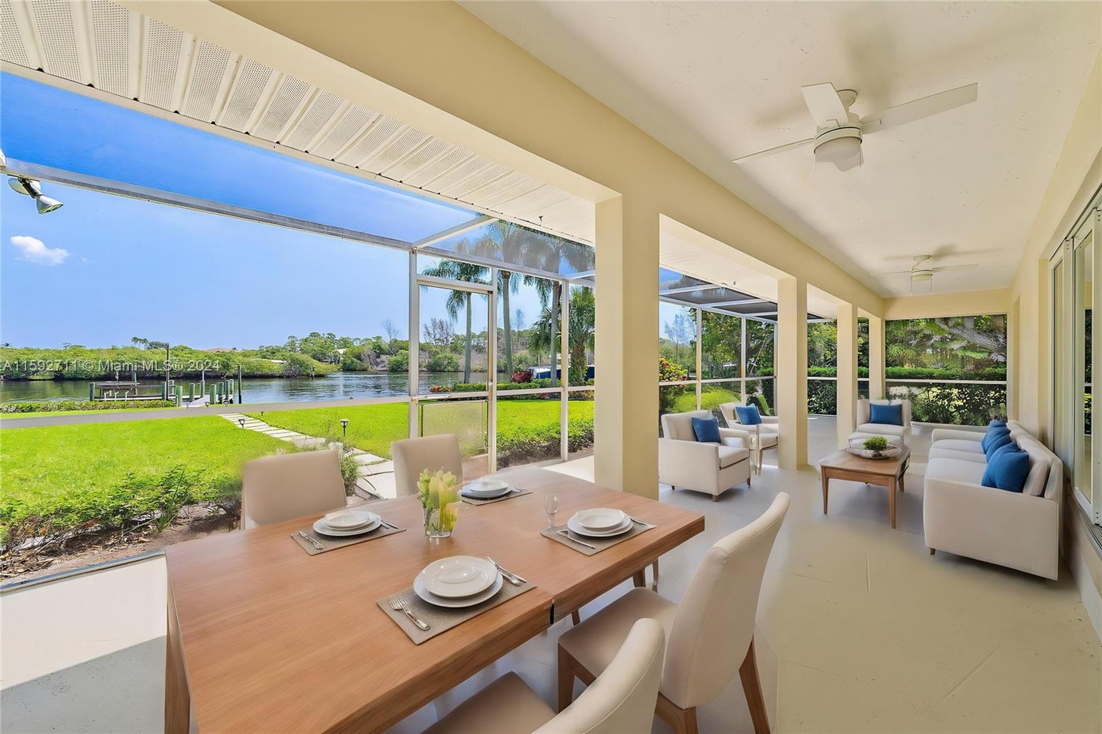 8547 Southeast Merritt Way Jupiter, FL 33458 - Photo 17 of 27 a view of a swimming pool and outdoor seating