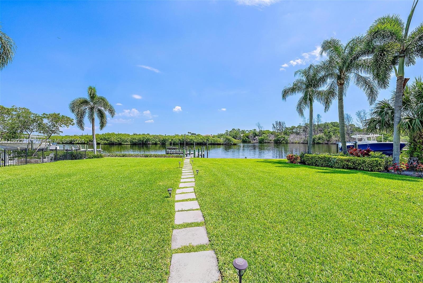 8547 Southeast Merritt Way Jupiter, FL 33458 - Photo 19 of 27 a view of a lake with a park