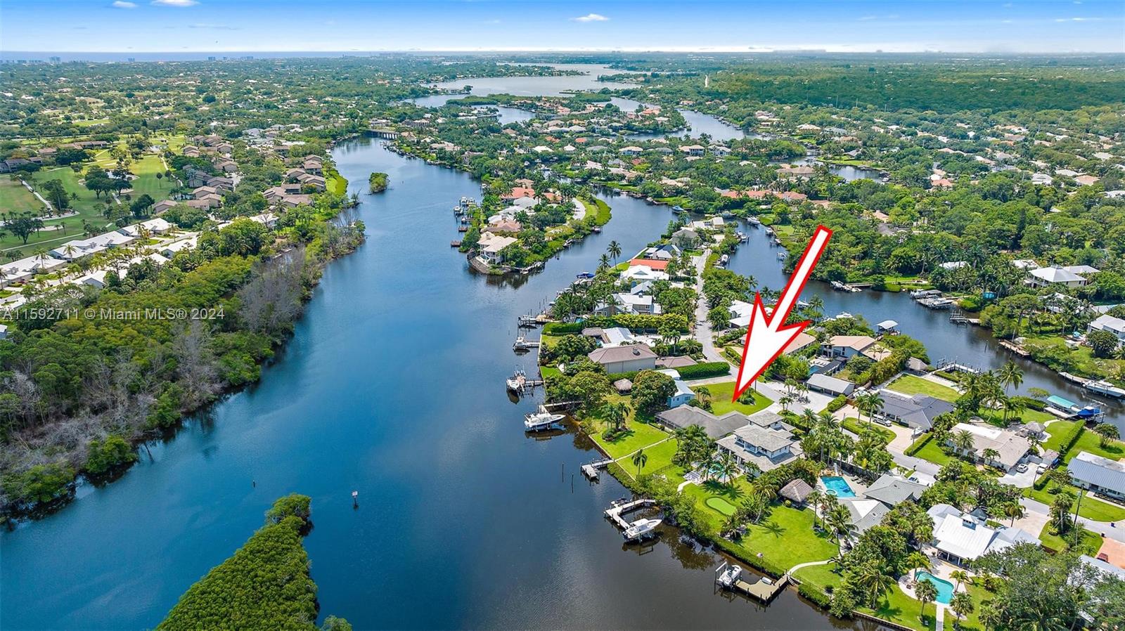 8547 Southeast Merritt Way Jupiter, FL 33458 - Photo 2 of 27 a view of a city with lots of trees