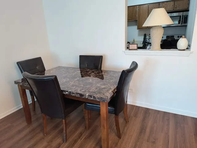 a dining room with furniture and window