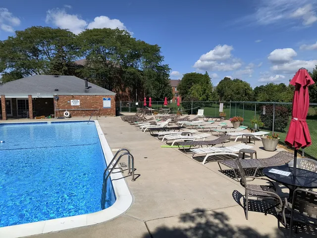 a view of a patio with swimming pool