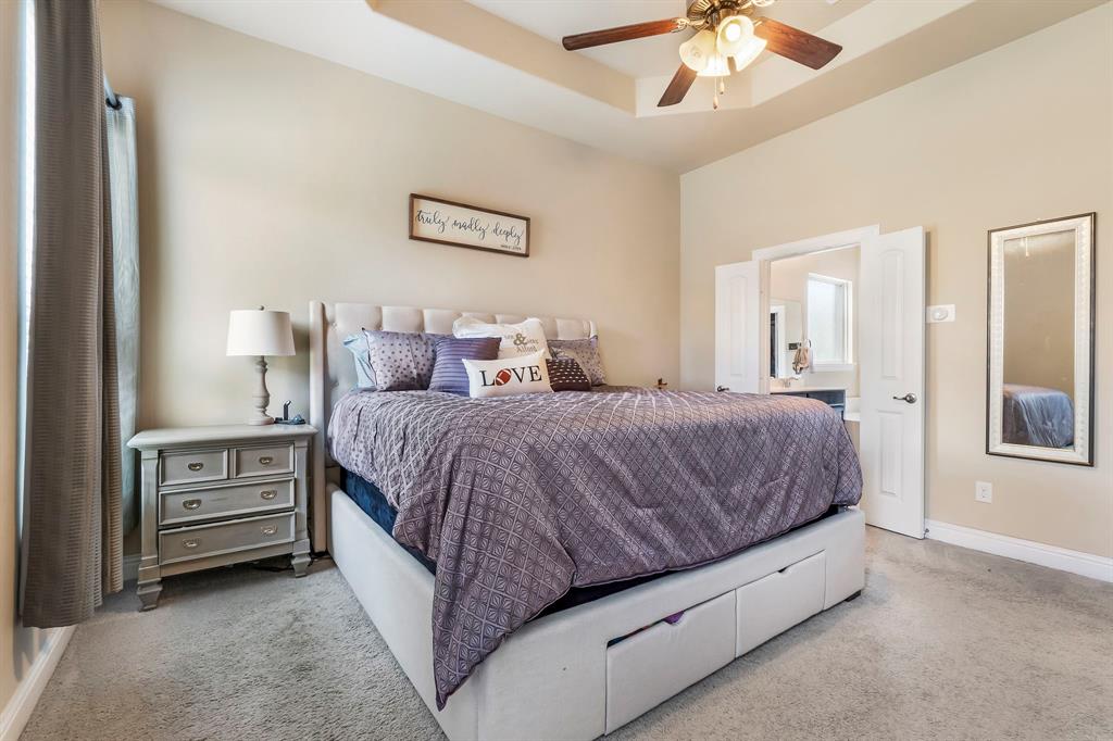 3610 Bastrop Street Melissa, TX 75454 - Photo 15 of 23 a spacious bedroom with a bed and a chandelier