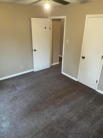 a view of a backyard with a large tree