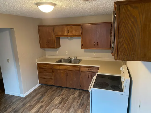 a room with a sink cabinets and utility room