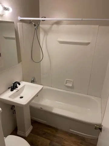 a bathroom with a sink and shower