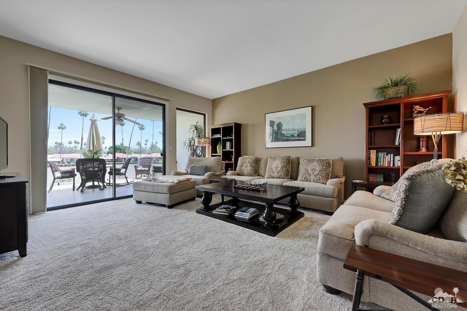 71 Calle Encinitas Rancho Mirage, CA 92270 - Photo 1 of 24 a living room with furniture and a large window