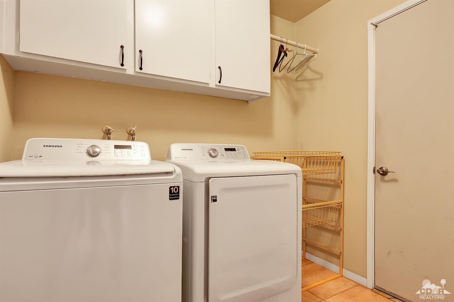 71 Calle Encinitas Rancho Mirage, CA 92270 - Photo 13 of 24 a utility room with dryer and washer