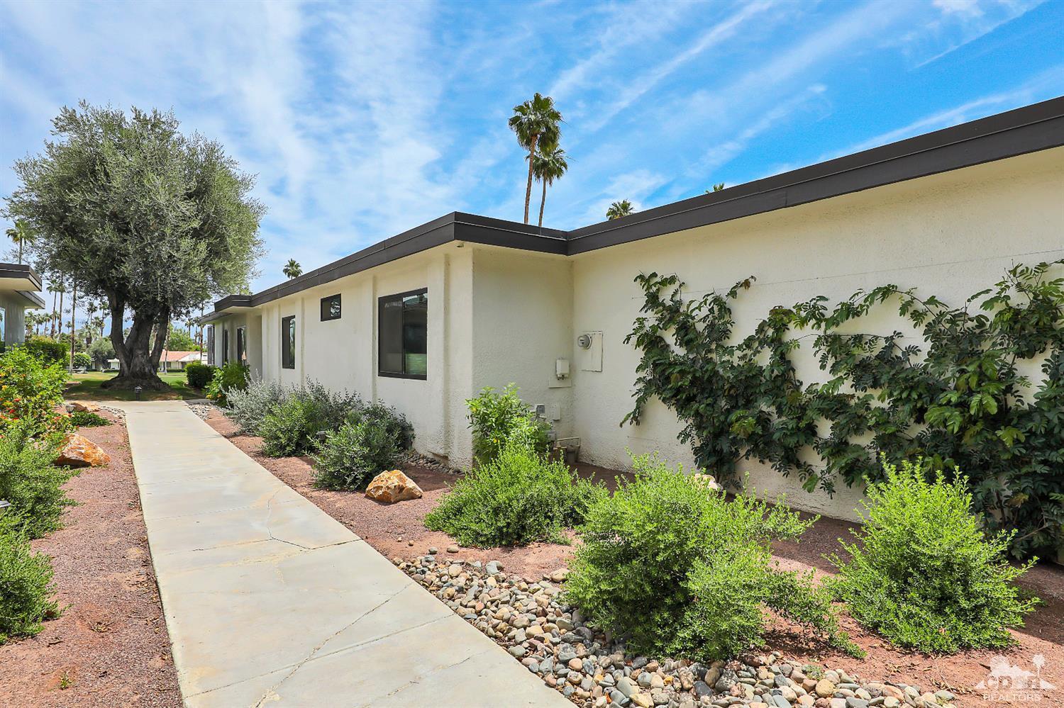 71 Calle Encinitas Rancho Mirage, CA 92270 - Photo 15 of 24 a front view of a house with a yard