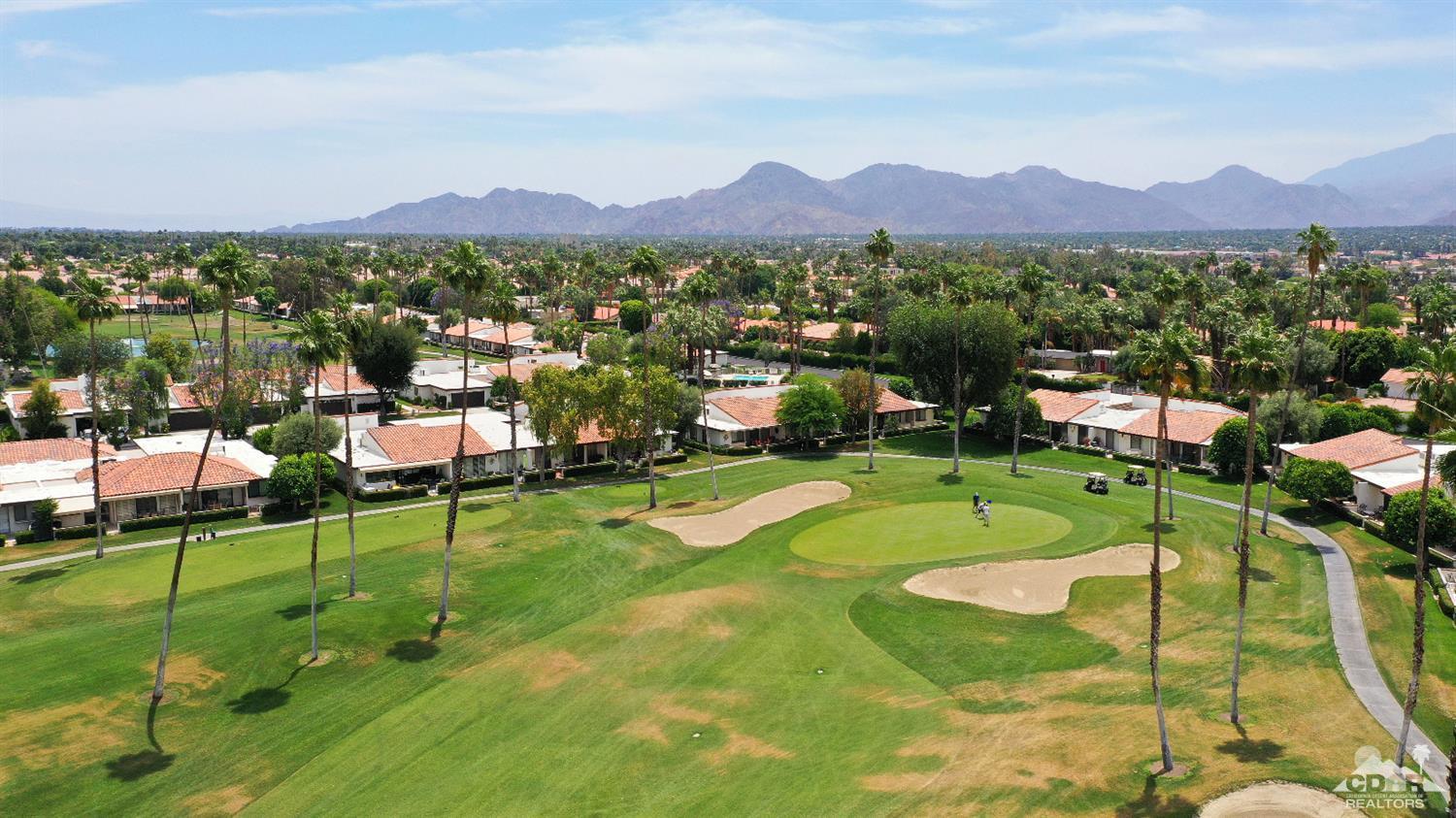 71 Calle Encinitas Rancho Mirage, CA 92270 - Photo 24 of 24 a view of a garden with a lake