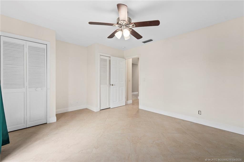 3281 Southwest Bobalink Way Palm City, FL 34990 - Photo 21 of 45 2nd bedroom with desk niche and 2 closets.