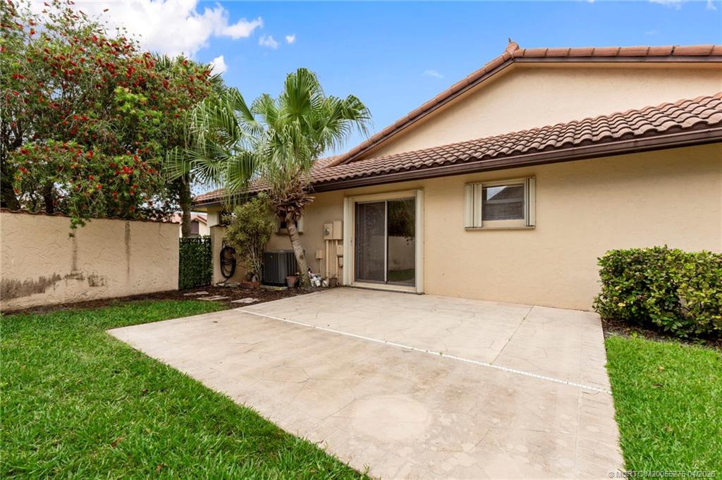 3281 Southwest Bobalink Way Palm City, FL 34990 - Photo 27 of 45 Side patio.
