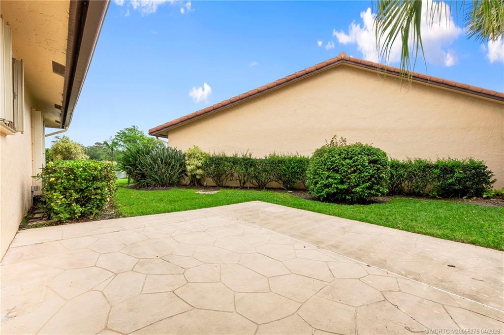 3281 Southwest Bobalink Way Palm City, FL 34990 - Photo 28 of 45 Side patio.