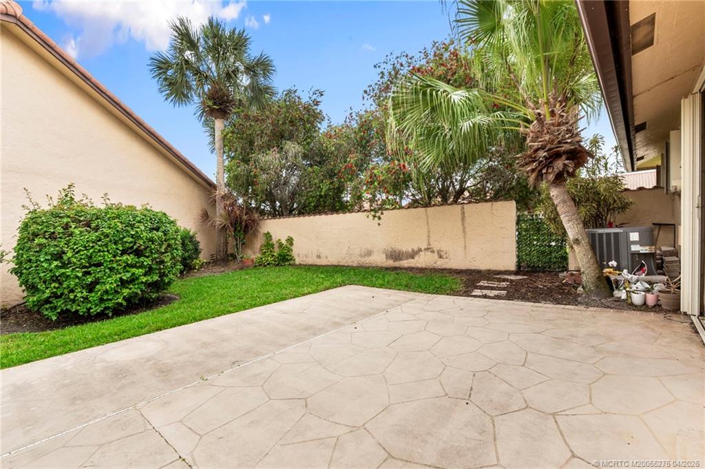 3281 Southwest Bobalink Way Palm City, FL 34990 - Photo 29 of 45 Side patio.