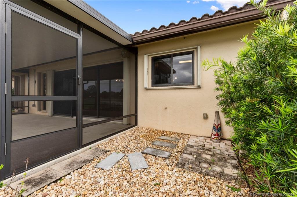 3281 Southwest Bobalink Way Palm City, FL 34990 - Photo 32 of 45 Grill/sitting area.