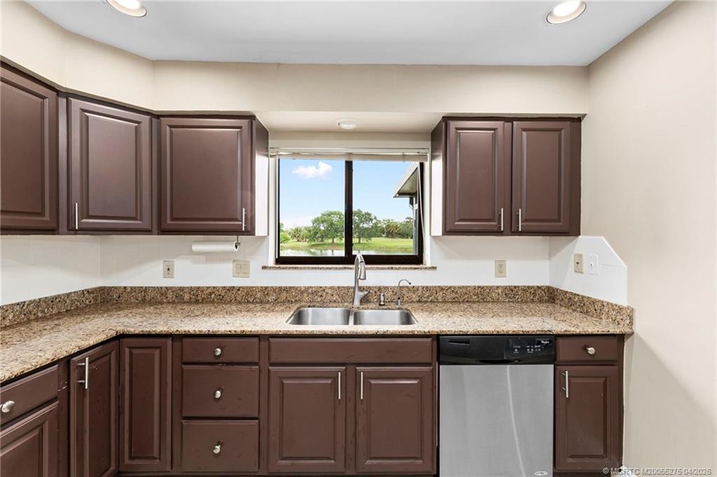 3281 Southwest Bobalink Way Palm City, FL 34990 - Photo 10 of 45 Lake view while doing the dishes!