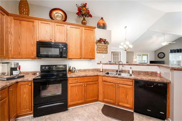 a kitchen with a sink stove and microwave