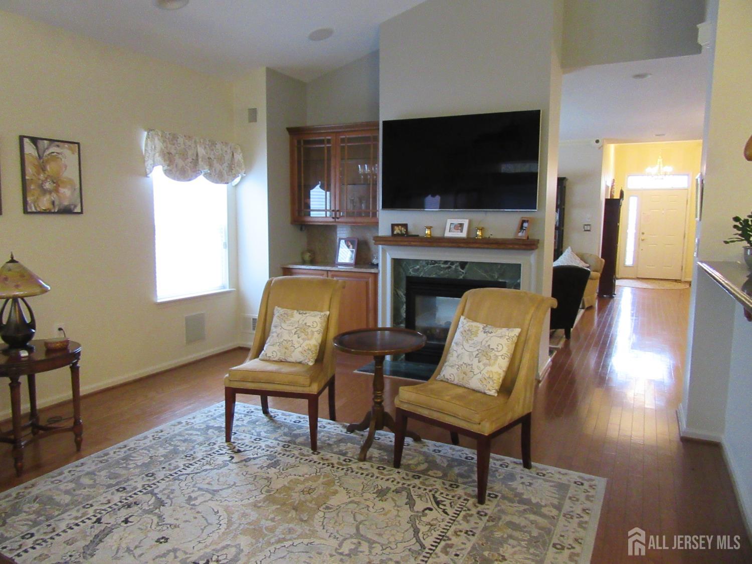 114 Orleans Road Monroe Township, NJ 08831 - Photo 7 of 22 a living room with furniture and a flat screen tv