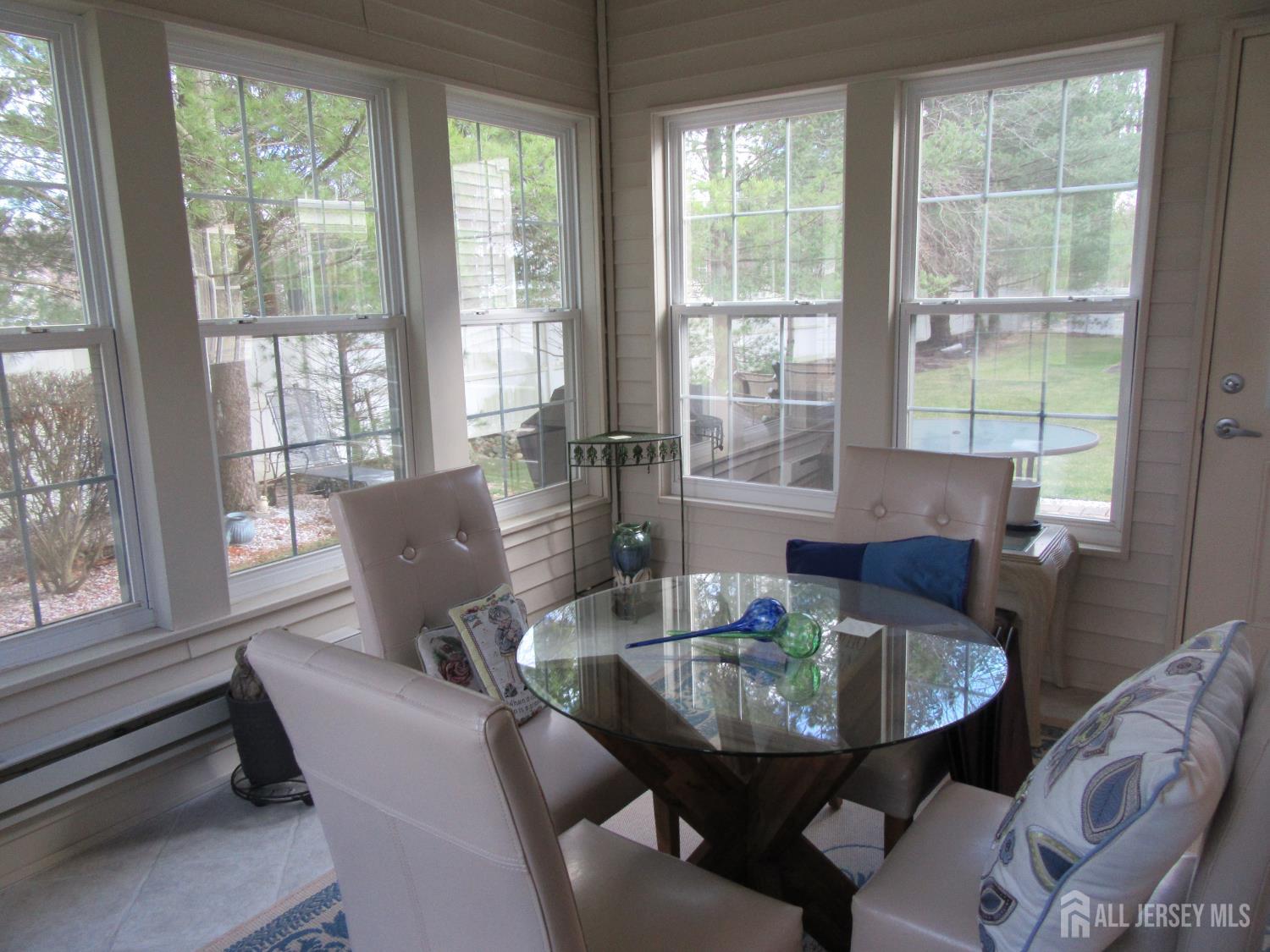 114 Orleans Road Monroe Township, NJ 08831 - Photo 9 of 22 a view of a dining room with furniture and window