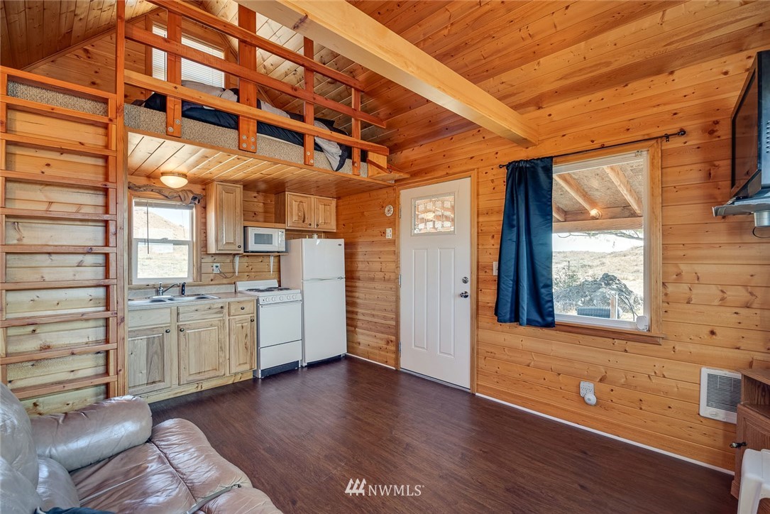 505 Rd 15th Street Northwest Waterville, WA 98858 - Photo 8 of 16 a view of a big room with wooden floor and windows