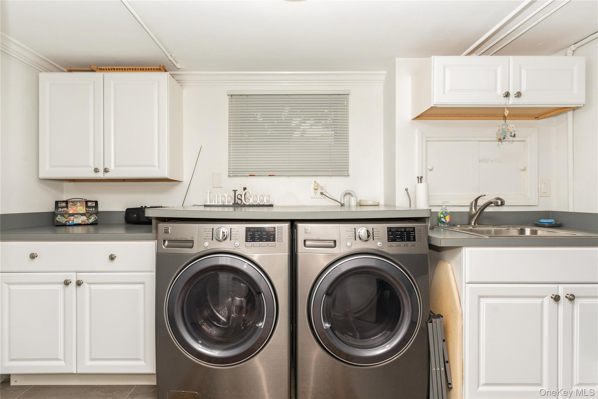 2772 Riverside Avenue Merrick, NY 11566 - Photo 22 of 45 a utility room with sink dryer and washer