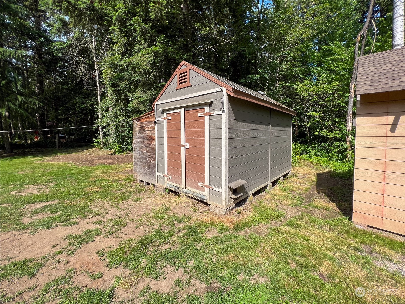 1958 Zell Road Ferndale, WA 98248 - Photo 12 of 28 a view of backyard with small cabin and wooden fence