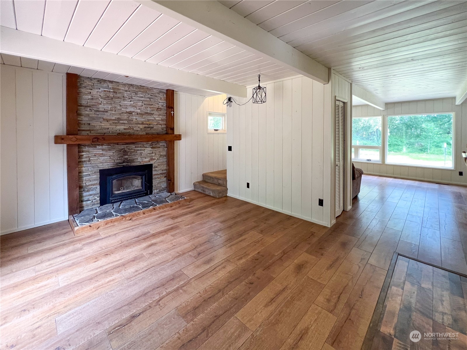 1958 Zell Road Ferndale, WA 98248 - Photo 20 of 28 a view of empty room with wooden floor and fireplace