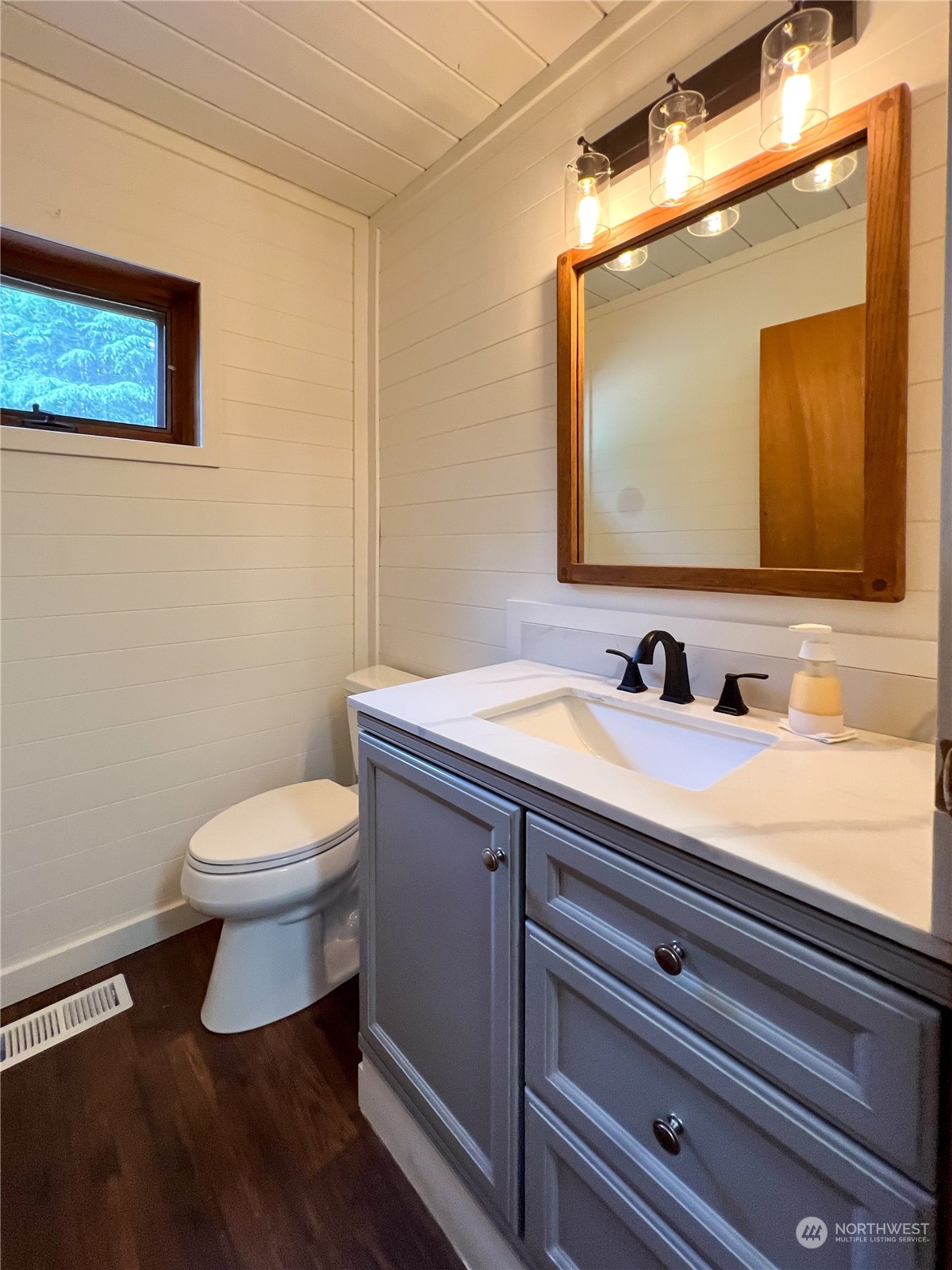 1958 Zell Road Ferndale, WA 98248 - Photo 28 of 28 a bathroom with a toilet sink and mirror