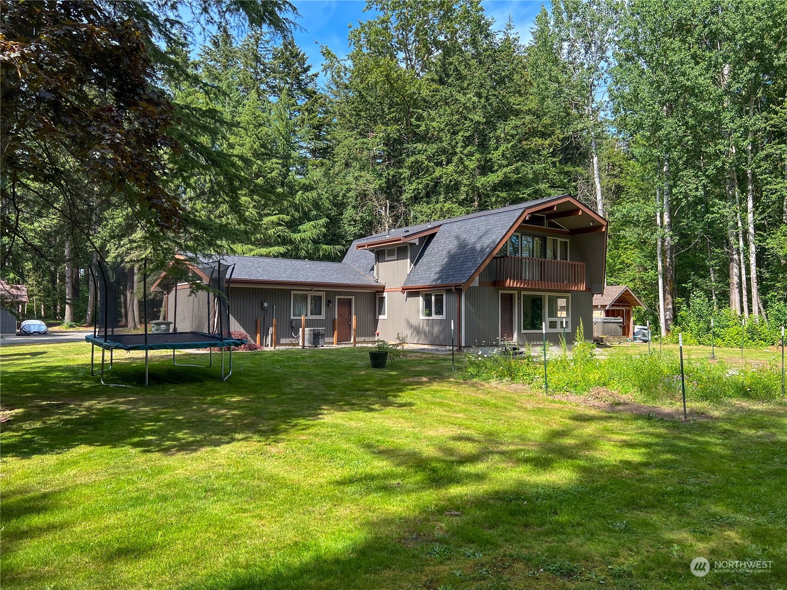 1958 Zell Road Ferndale, WA 98248 - Photo 9 of 28 a view of a big house with a big yard and large trees