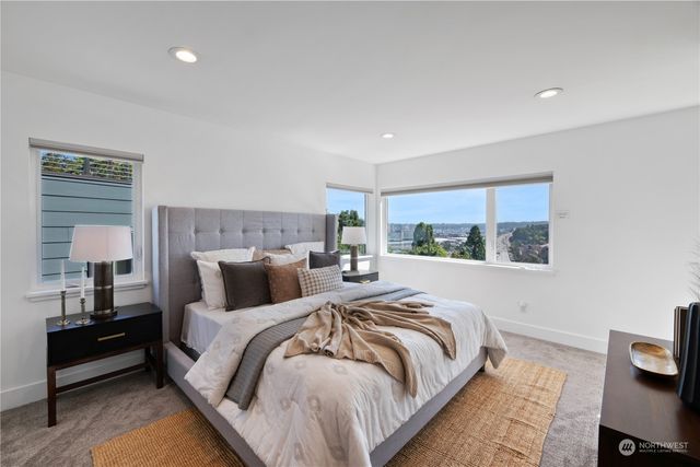 a bedroom with double bed and a window