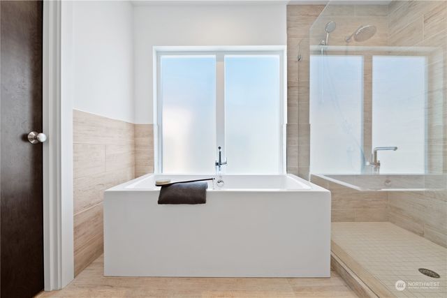 a white bath tub sitting in a bathroom