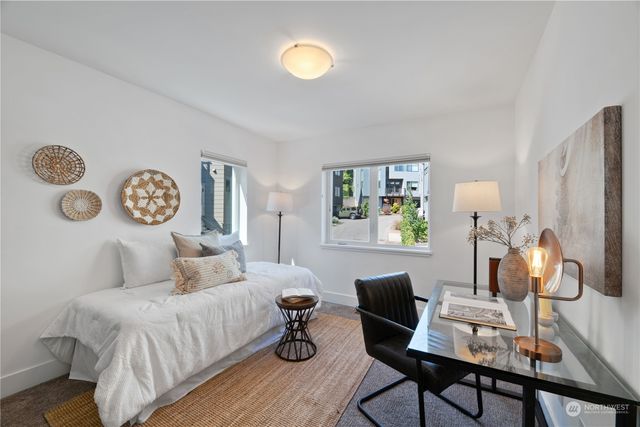 a bedroom with a bed and a table with chair