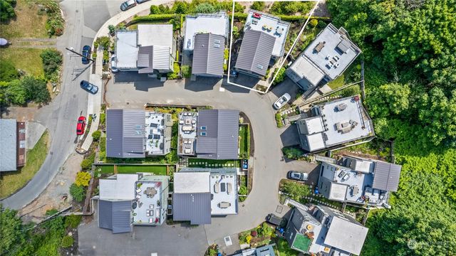 an aerial view of multiple houses with outdoor space