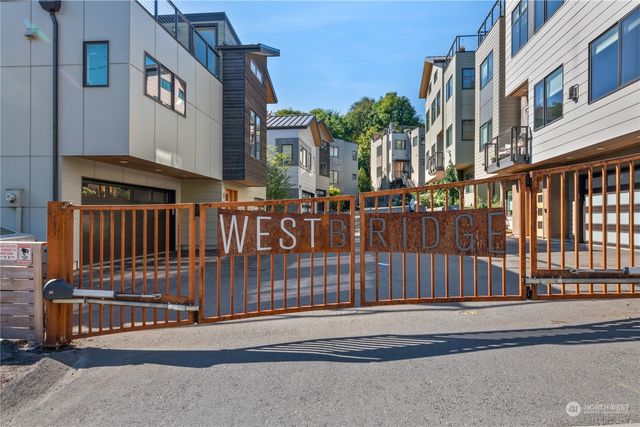 a view of a street with brick walls